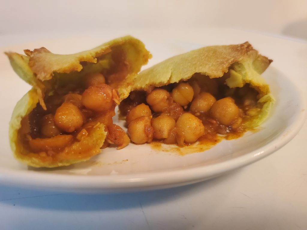 CHANA MASALA : Indian curried dish made with white chickpeas, onions, tomatoes, spices and herbs.